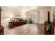 Inviting living room with wood-look floors, a leather sofa, and bright natural light at 2105 S Zinnia Ave # 468, Mesa, AZ 85209