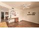 Inviting living room with hardwood floors, a ceiling fan, and built-in workspace at 2105 S Zinnia Ave # 468, Mesa, AZ 85209