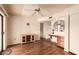 Cozy living room featuring hardwood floors, ceiling fan, and built-in desk at 2105 S Zinnia Ave # 468, Mesa, AZ 85209