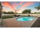 Resort-style backyard featuring a pool, desert landscaping, and patio at 21665 N 47Th Pl, Phoenix, AZ 85050