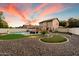 Beautiful backyard with a pool, putting green, and an outdoor seating area at 21665 N 47Th Pl, Phoenix, AZ 85050
