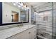 Renovated bathroom featuring marble countertops, a new sink, faucet, vanity and a frameless shower at 21665 N 47Th Pl, Phoenix, AZ 85050