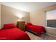 Bedroom offers two beds, carpet flooring and a matching wooden dresser at 21665 N 47Th Pl, Phoenix, AZ 85050