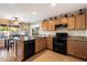 Functional kitchen with stainless steel appliances, granite countertops, and access to the dining area at 21665 N 47Th Pl, Phoenix, AZ 85050