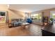 Spacious living room with tile flooring, large windows offering natural light, and comfortable seating at 21665 N 47Th Pl, Phoenix, AZ 85050
