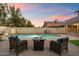 Backyard pool area with outdoor seating, grill, and desert landscaping at 21665 N 47Th Pl, Phoenix, AZ 85050