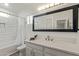 Bright bathroom with a large mirror, vanity, and tiled shower-tub combination at 2402 E 5Th St # 1457, Tempe, AZ 85288