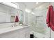 Modern bathroom features glass-enclosed shower, quartz countertops and stylish fixtures at 2402 E 5Th St # 1457, Tempe, AZ 85288