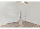Bedroom featuring a ceiling fan, wood-look flooring and closet at 2402 E 5Th St # 1457, Tempe, AZ 85288