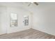 Bright bedroom with fan and multiple windows at 2402 E 5Th St # 1457, Tempe, AZ 85288
