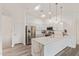 Contemporary kitchen with oversized island with stainless steel appliances, and white cabinetry at 2402 E 5Th St # 1457, Tempe, AZ 85288