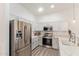 Modern kitchen featuring stainless steel appliances, white cabinetry, and quartz countertops at 2402 E 5Th St # 1457, Tempe, AZ 85288