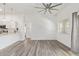 Spacious living room with modern ceiling fan and large window at 2402 E 5Th St # 1457, Tempe, AZ 85288