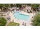 Aerial view of community pool, with lounge chairs and shade canopies at 2402 E 5Th St # 1457, Tempe, AZ 85288