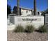 Community sign with address and view of buildings and palm trees in the Villagio neighborhood at 2402 E 5Th St # 1457, Tempe, AZ 85288