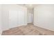 Neutral bedroom with carpet, closet, and a light fixture at 25945 W Runion Dr, Buckeye, AZ 85396