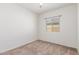 Bedroom with neutral walls, carpet, and a window at 25945 W Runion Dr, Buckeye, AZ 85396