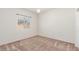 Bedroom with carpet, neutral walls, a window, and modern lighting at 25945 W Runion Dr, Buckeye, AZ 85396