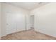 Neutral bedroom with carpet, closet, and an open door to the rest of the home at 25945 W Runion Dr, Buckeye, AZ 85396