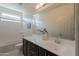 Bathroom featuring white countertop, dark cabinets, and white hexagon tile flooring at 2680 E Daniel Dr, Gilbert, AZ 85298