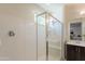 Modern bathroom showcasing a glass-enclosed shower with seating and sleek fixtures at 2680 E Daniel Dr, Gilbert, AZ 85298