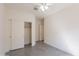 Neutral bedroom with tiled floors, ceiling fan, and closet with sliding doors at 2680 E Daniel Dr, Gilbert, AZ 85298