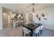 Dining area adjacent to kitchen features modern lighting and access to the kitchen and breakfast area at 2680 E Daniel Dr, Gilbert, AZ 85298