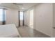 Bright bedroom featuring two windows, an open doorway, tiled floors, and a ceiling fan at 2680 E Daniel Dr, Gilbert, AZ 85298