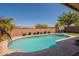 Inviting backyard pool with clear blue water and a basketball hoop, perfect for outdoor fun at 2680 E Daniel Dr, Gilbert, AZ 85298