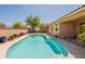 Backyard pool with a basketball hoop, surrounded by a deck and landscaping, adjacent to the home at 2680 E Daniel Dr, Gilbert, AZ 85298
