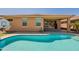 Swimming pool leading to a covered patio with glass sliding doors, enhancing the indoor/outdoor living space at 2680 E Daniel Dr, Gilbert, AZ 85298