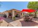 Enjoy the spacious outdoor patio with shade, seating, and room for activities, perfect for backyard gatherings at 2896 W Hayden Peak Dr, San Tan Valley, AZ 85144