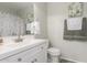 Well-lit bathroom with a white vanity, and decorative art pieces at 2896 W Hayden Peak Dr, San Tan Valley, AZ 85144