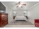 Bright bedroom featuring king bed, decorative rug, and contemporary ceiling fan at 2896 W Hayden Peak Dr, San Tan Valley, AZ 85144