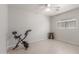 Spacious bedroom featuring neutral walls, tile floor, and ceiling fan at 2896 W Hayden Peak Dr, San Tan Valley, AZ 85144