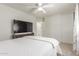Cozy bedroom featuring neutral walls, fan, and sliding closet doors at 2896 W Hayden Peak Dr, San Tan Valley, AZ 85144