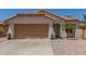 Charming single-story home featuring a two-car garage, low maintenance landscaping, and a terracotta tile roof at 2896 W Hayden Peak Dr, San Tan Valley, AZ 85144