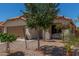 Charming single-story home with desert landscaping, two-car garage, driveway and terracotta tile roof at 2896 W Hayden Peak Dr, San Tan Valley, AZ 85144