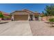 Charming single-story home featuring a two-car garage, low maintenance landscaping, and a terracotta tile roof at 2896 W Hayden Peak Dr, San Tan Valley, AZ 85144