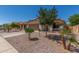 Charming single-story home with desert landscaping, two-car garage, driveway and terracotta tile roof at 2896 W Hayden Peak Dr, San Tan Valley, AZ 85144