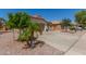 Charming single-story home with desert landscaping, two-car garage, driveway and terracotta tile roof at 2896 W Hayden Peak Dr, San Tan Valley, AZ 85144