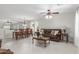 Open-concept living room and dining area featuring neutral paint, tile flooring, and natural light at 2896 W Hayden Peak Dr, San Tan Valley, AZ 85144