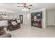 Open living space with modern fireplace, ceiling fan, and neutral decor at 2896 W Hayden Peak Dr, San Tan Valley, AZ 85144