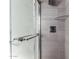 This bathroom features a modern shower with tiled walls and glass shelving at 2941 N 19Th Ave # 95, Phoenix, AZ 85015
