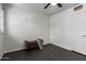 Bedroom with gray tile floors, a ceiling fan, and a comfortable upholstered bench at 2941 N 19Th Ave # 95, Phoenix, AZ 85015