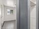 Hallway leading to a bedroom with gray tile floors, a ceiling fan, and closet space at 2941 N 19Th Ave # 95, Phoenix, AZ 85015