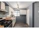 Bright kitchen featuring white cabinets, wooden countertops, stainless steel appliances and a farmhouse sink at 2941 N 19Th Ave # 95, Phoenix, AZ 85015