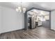 Spacious living room leading to a modern kitchen and dining area at 2941 N 19Th Ave # 95, Phoenix, AZ 85015
