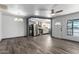 Open-concept living room with wood-look flooring, connecting to the modern kitchen at 2941 N 19Th Ave # 95, Phoenix, AZ 85015