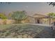 Spacious backyard with covered patio, privacy fence, and well manicured lawn at 3351 W Via Del Sol Dr, Phoenix, AZ 85027